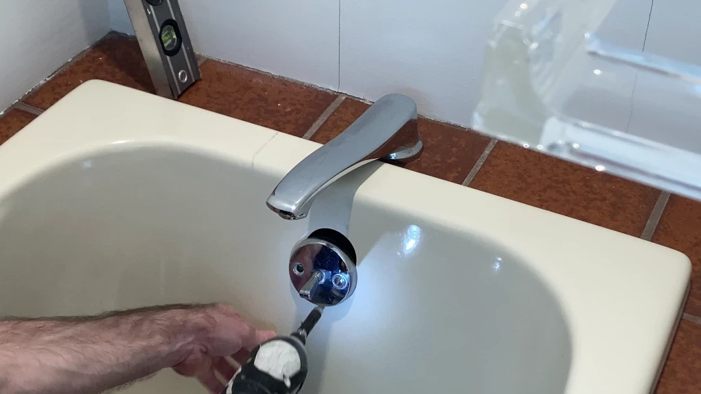 Removing tub overflow trim