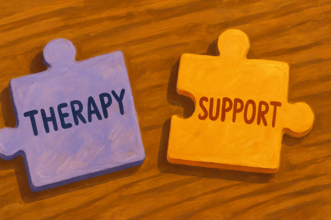 Two puzzle pieces on a wooden table—one light purple labeled “Therapy” and one yellow labeled “Support”—symbolising the integrated components of an individualised NDIS autism plan.