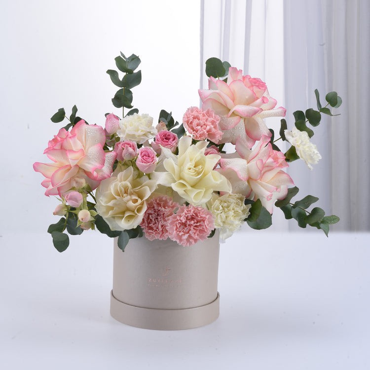 Pink and white flowers in a box
