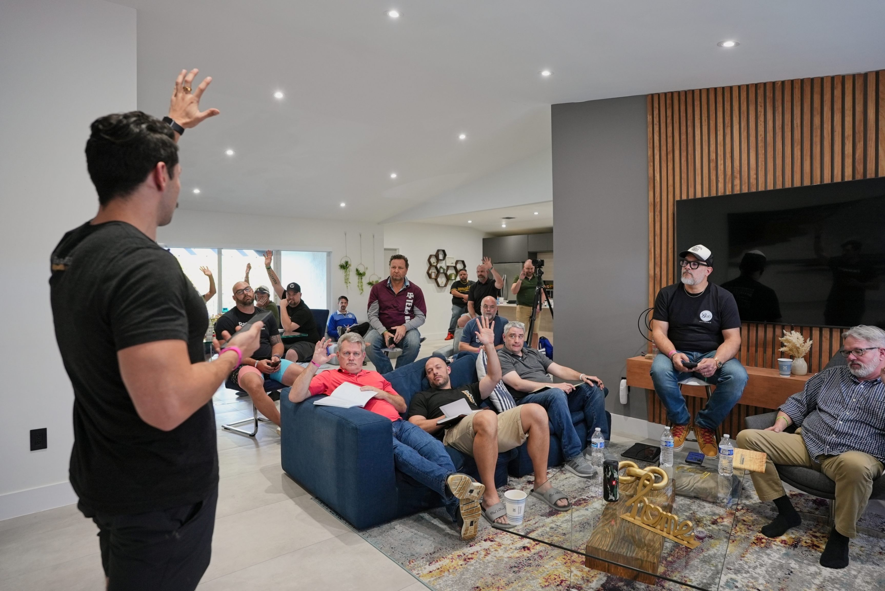 Joseph Wilder with members of Ascend Media leading a men’s empowerment and leadership workshop, group gathered in a modern living room setting. Joseph Wilder with members of Ascend Media leading a men’s empowerment and leadership workshop, group gathered in a modern living room setting.
