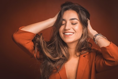 a happy woman wearing ICE hair extensions