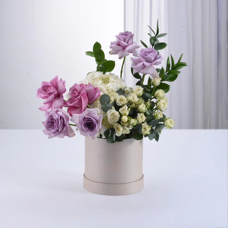 Pink and White flowers in zuvees box