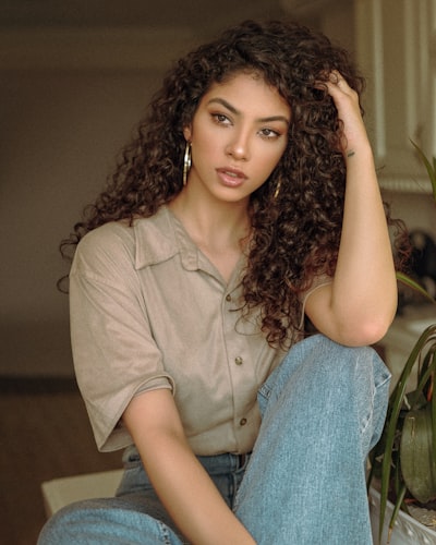 a young woman with a curly hair perm