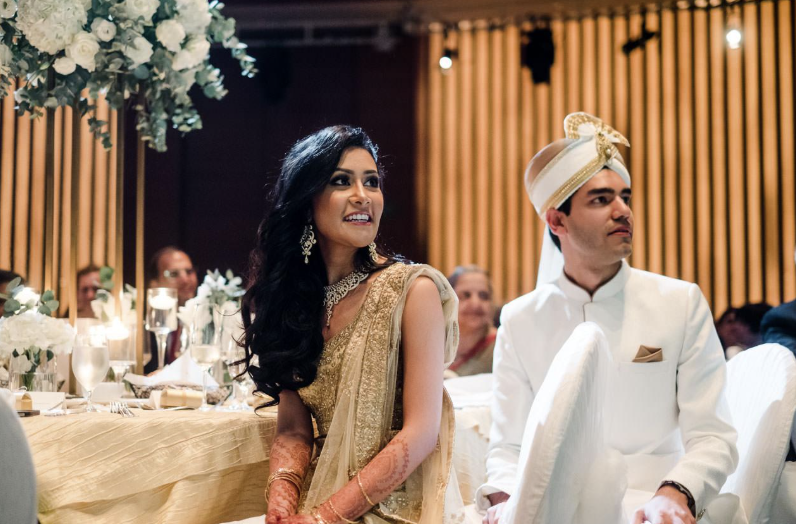Malay Muslim couple celebrating their wedding reception with Halal catering in Singapore.