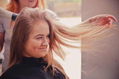 a hairstylist doing Japanese Hair Straightening