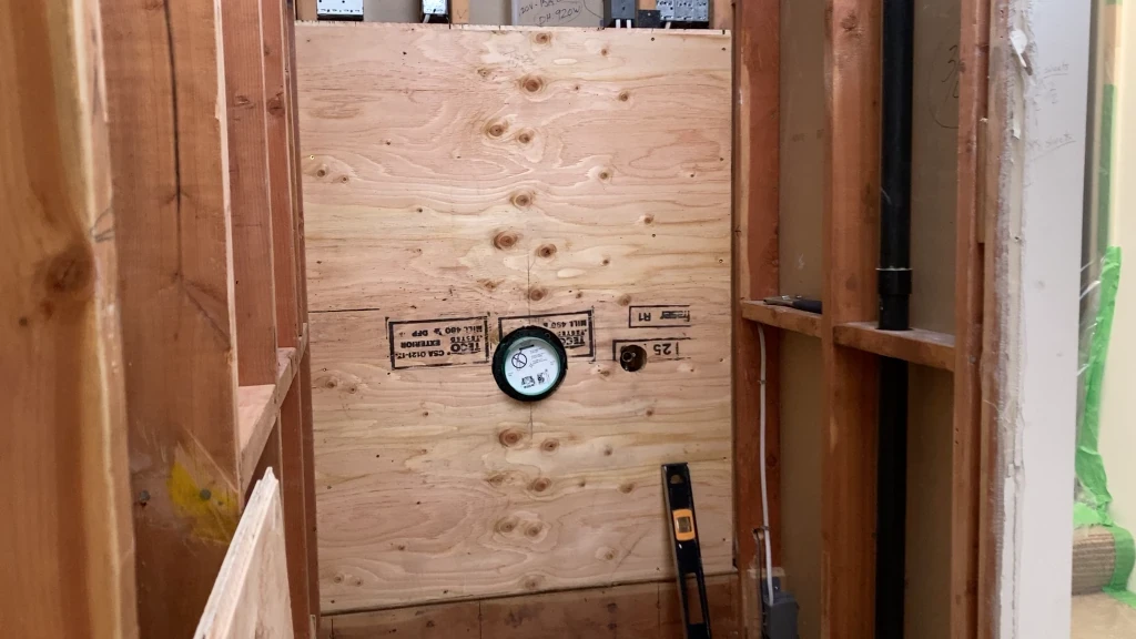 Plywood installed to furr-out valve wall
