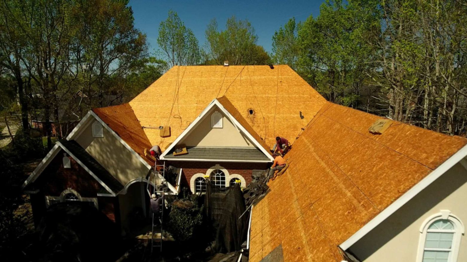 a new roof being installed by wise builders in mobile al showing off their worshmanship