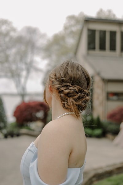 a woman wearing a lace wig hairstyle up