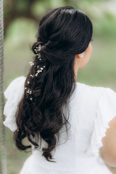 Bride wearing clip-in hair extensions for a voluminous bridal hairstyle