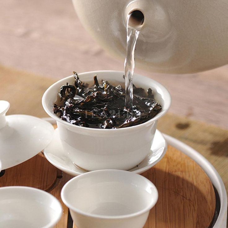 Hot water being poured in the cup to make tea