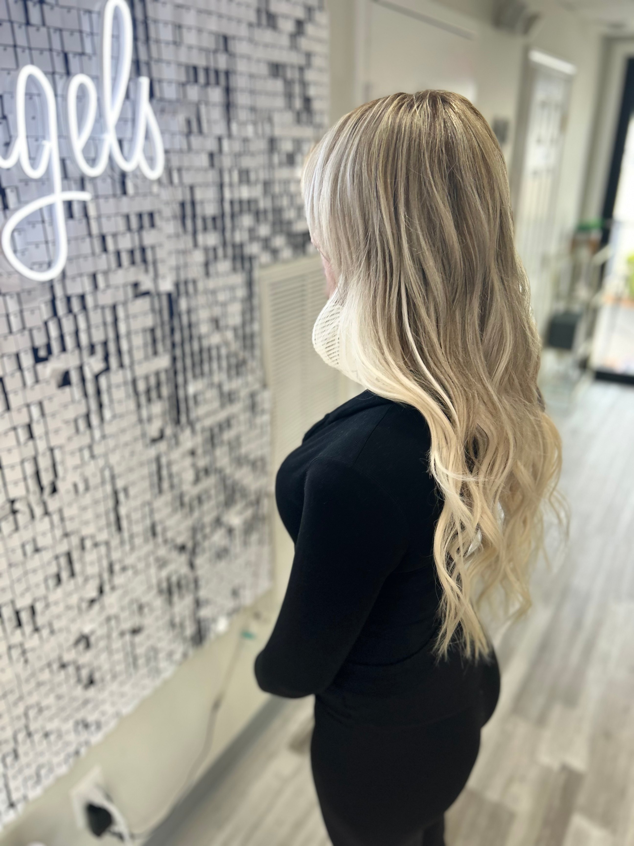 a woman wearing micro hair extensions for thin hair