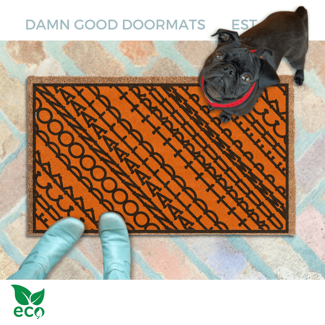 a pair of feet in Smurf blue boots standing on a quirky colorful Halloween pumpkin orange doormat with a geometric Fuck Donald Trump pattern
