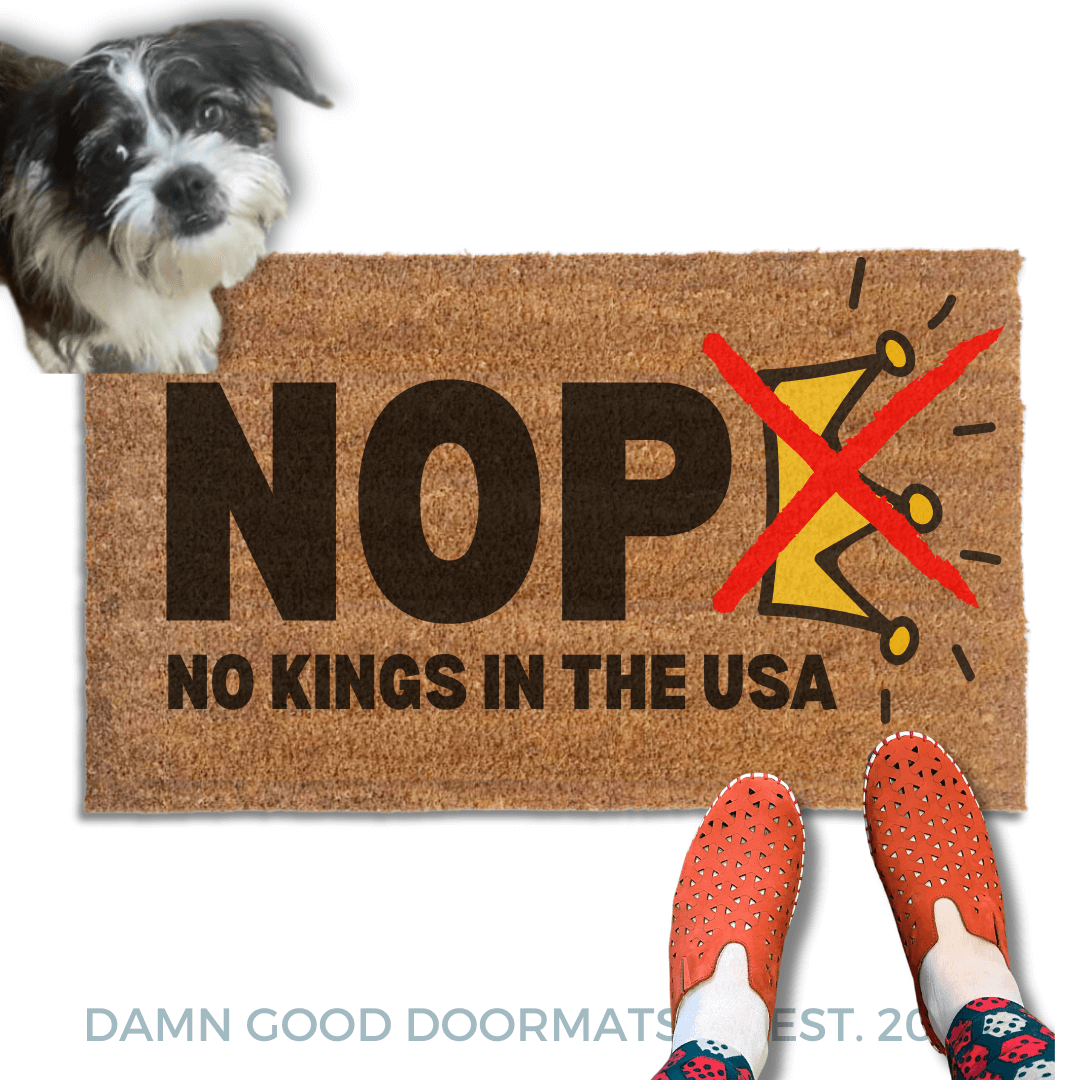 No Kings in the USA doormat  pictured with a rescue terriet dog and someone in red slippers