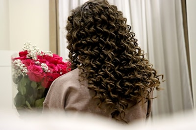 a woman with a spiral perm