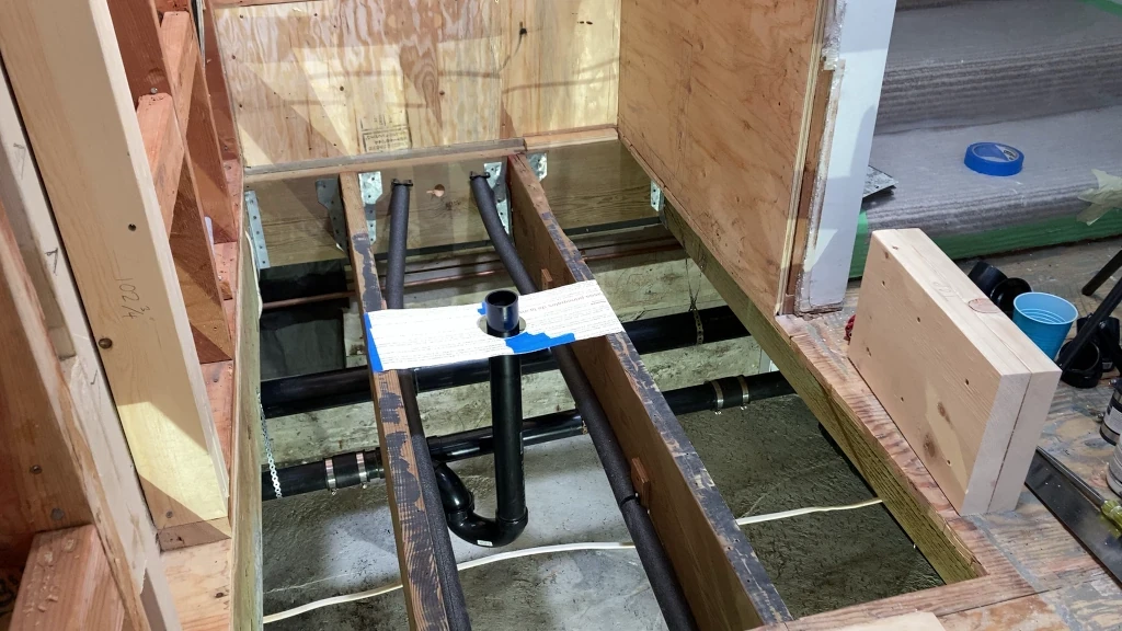 Subfloor reinforcement under shower pony wall - before