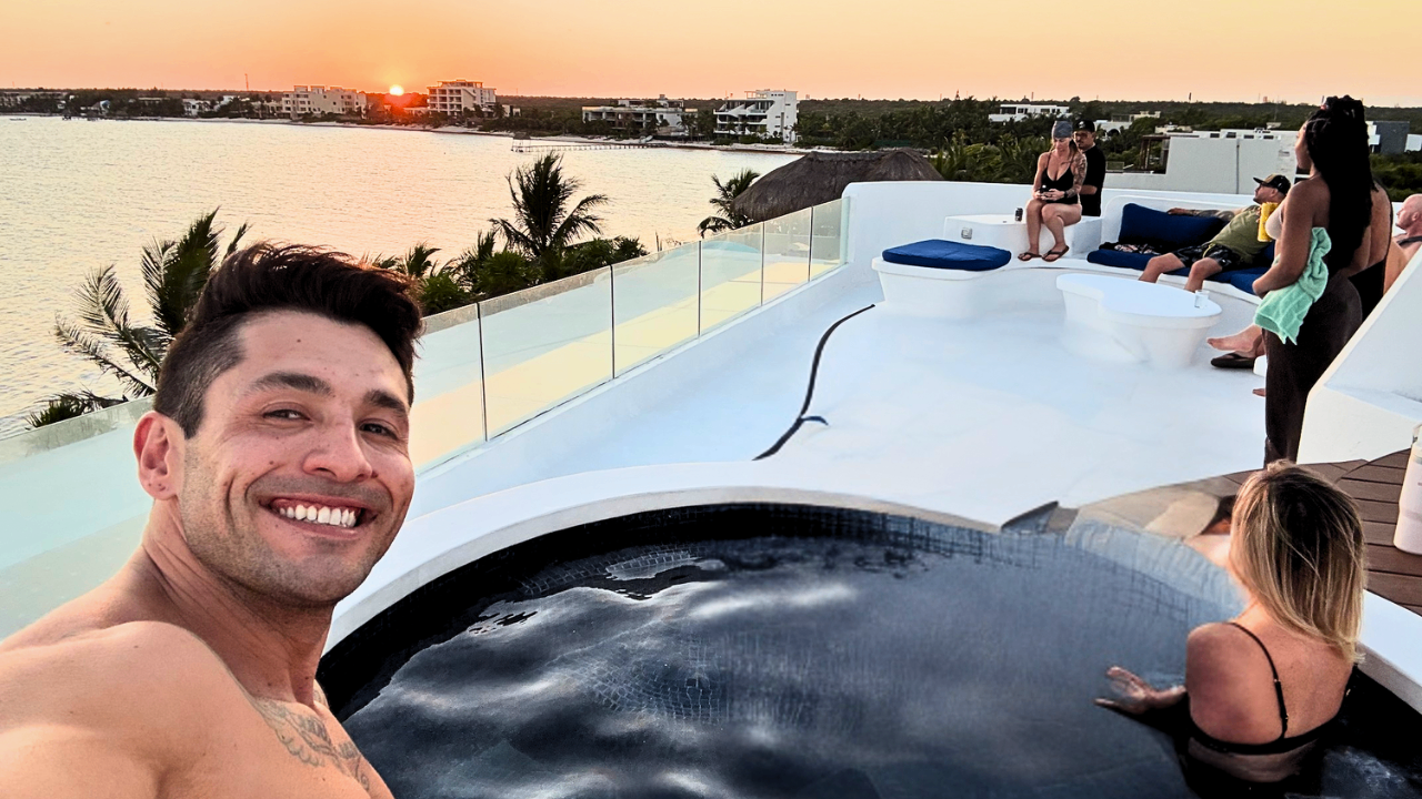 Group enjoying rooftop sunset near ocean — relaxed atmosphere and networking by Ascend Media team retreat. Group enjoying rooftop sunset near ocean — relaxed atmosphere and networking by Ascend Media team retreat.