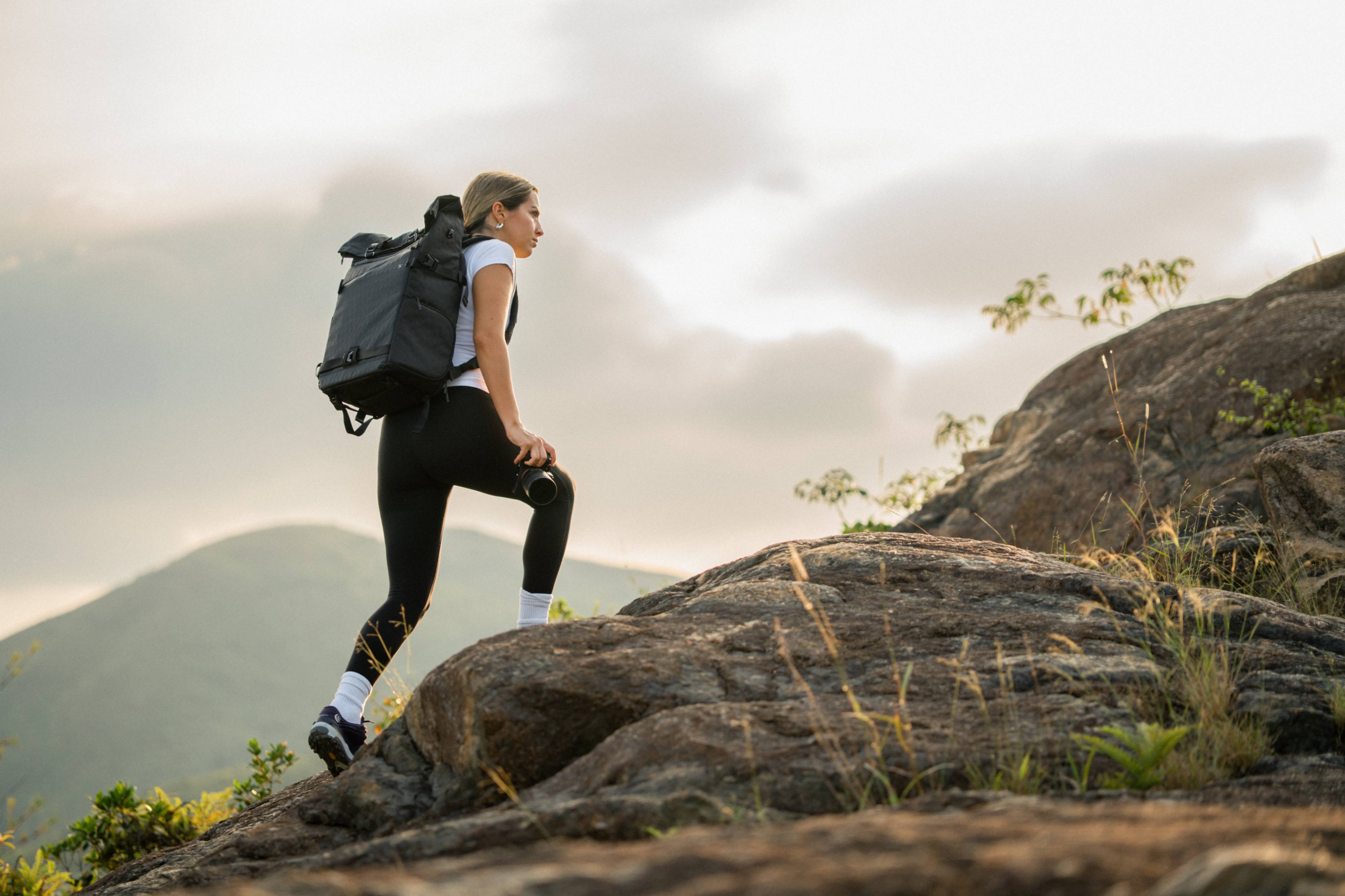woman climbing mountain