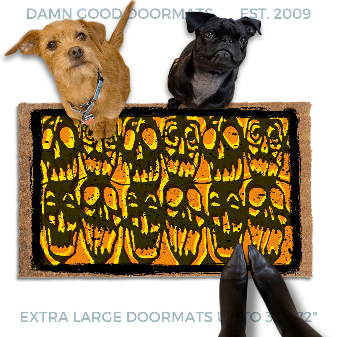 Gen X Halloween doormat with orange and black skulls stencil from 1985 cult film Desperately Seeking Susan on an outdoor doormat. Pictured with a black pug and terrier daogs and a woman in pointy toed witch boots.