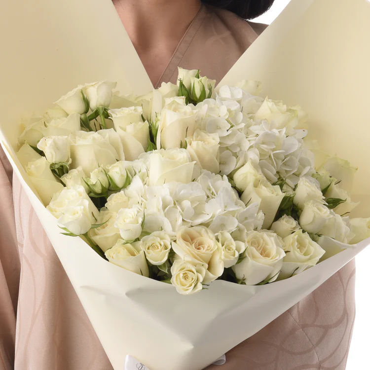White roses packed in white bouquet