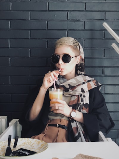 Trans woman with a pixie cut showing feminine soft layers and undercut style. Short haircuts, combined with a good attitude, play a significant role in enhancing the overall look