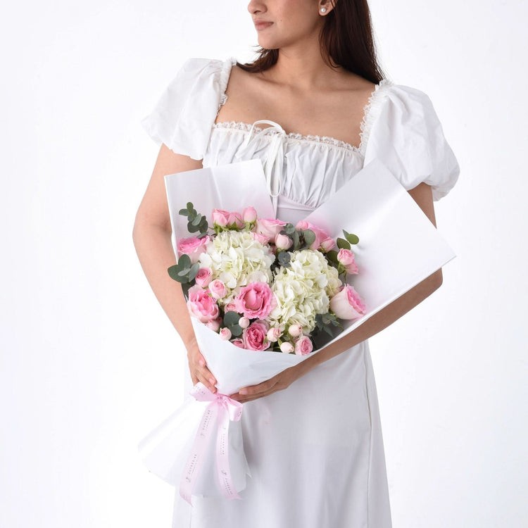 Girl holding a bouquet of flowers