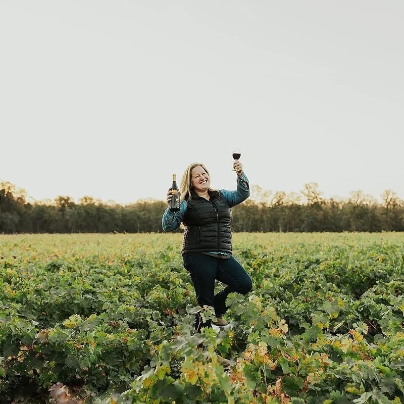 The winemaker in the vineyard welcoming you