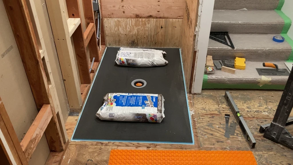 Setting thinset under Wedi shower tray