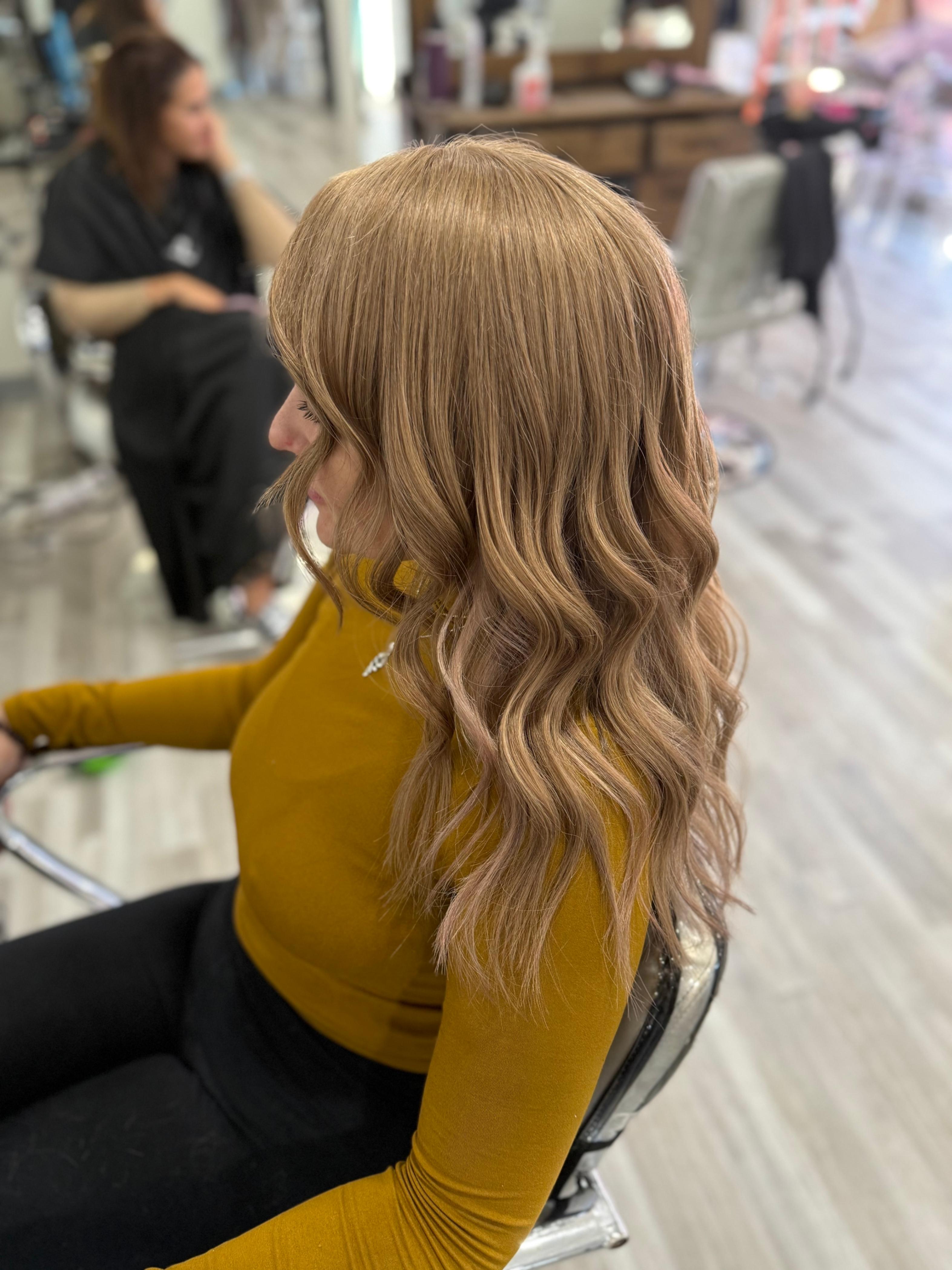 a woman wearing a hair topper at Noelle Salon