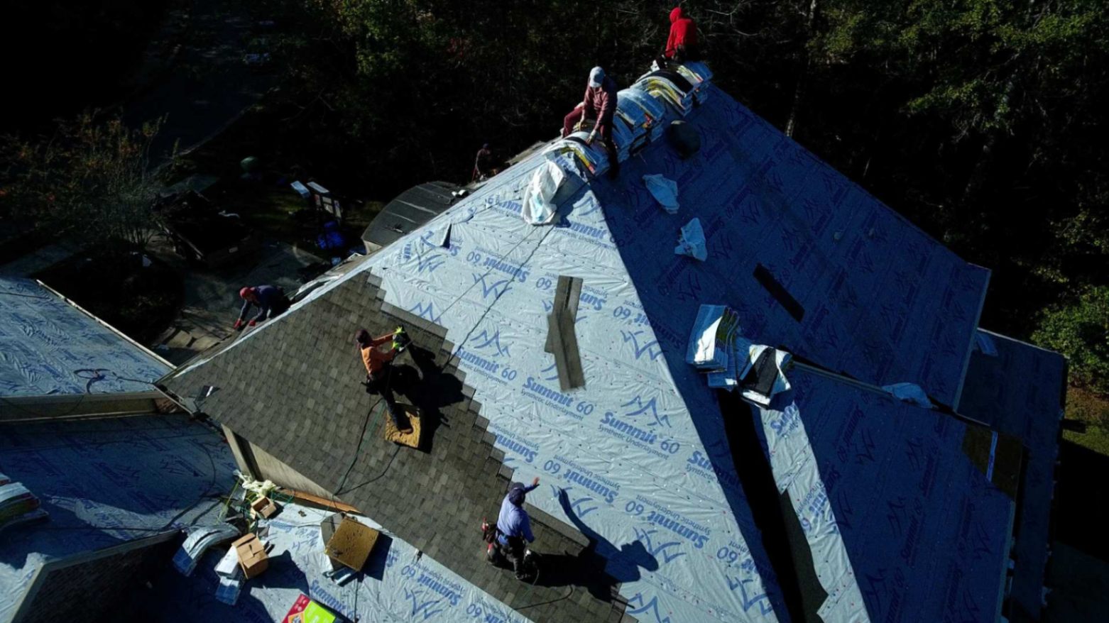 roofing and siding experts wise builders  performing a roof replacment