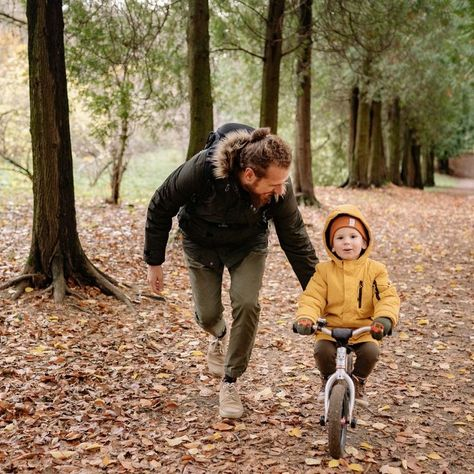 Dad teaching his kid to cycle