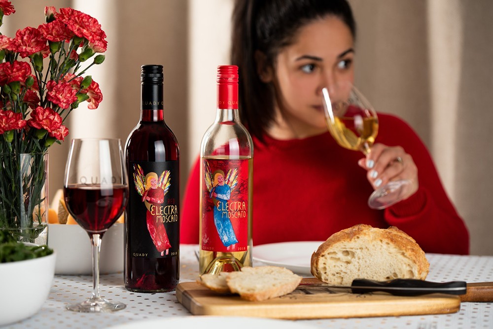 woman enjoying wine and bread