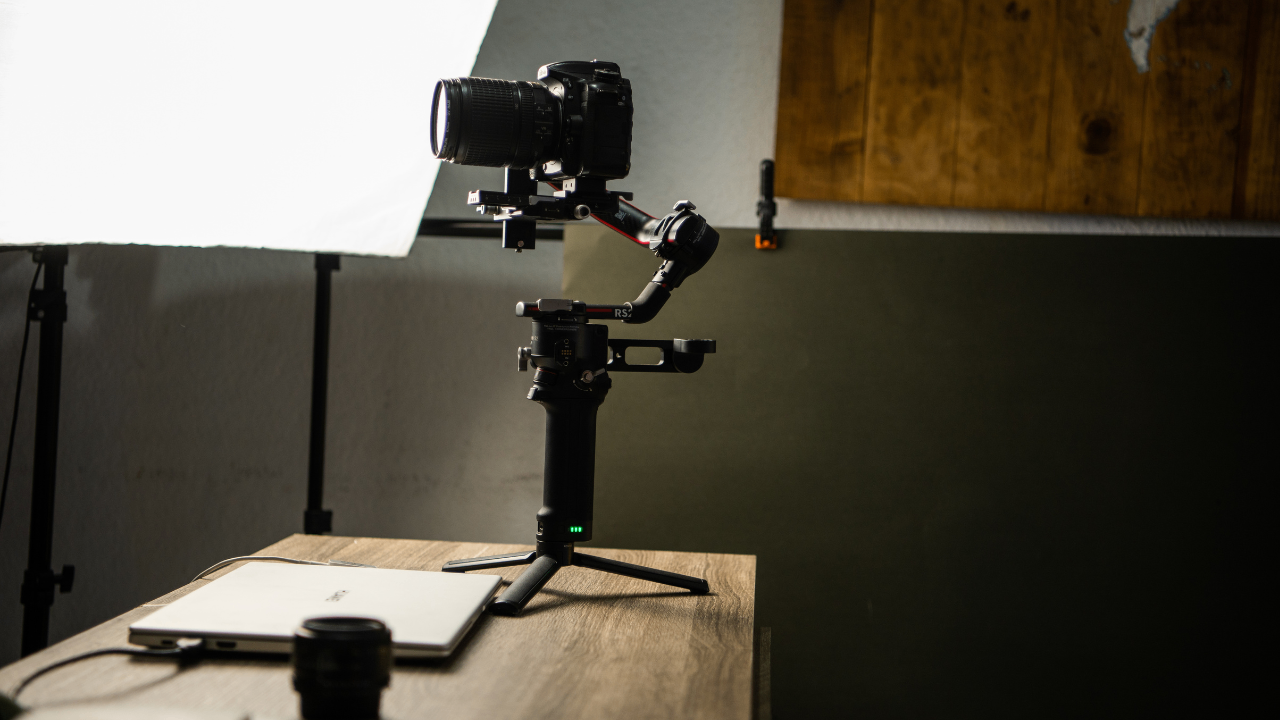 Ascend Media professional video production setup with DSLR camera, gimbal, and lighting for cinematic content creation. Ascend Media professional video production setup with DSLR camera, gimbal, and lighting for cinematic content creation.