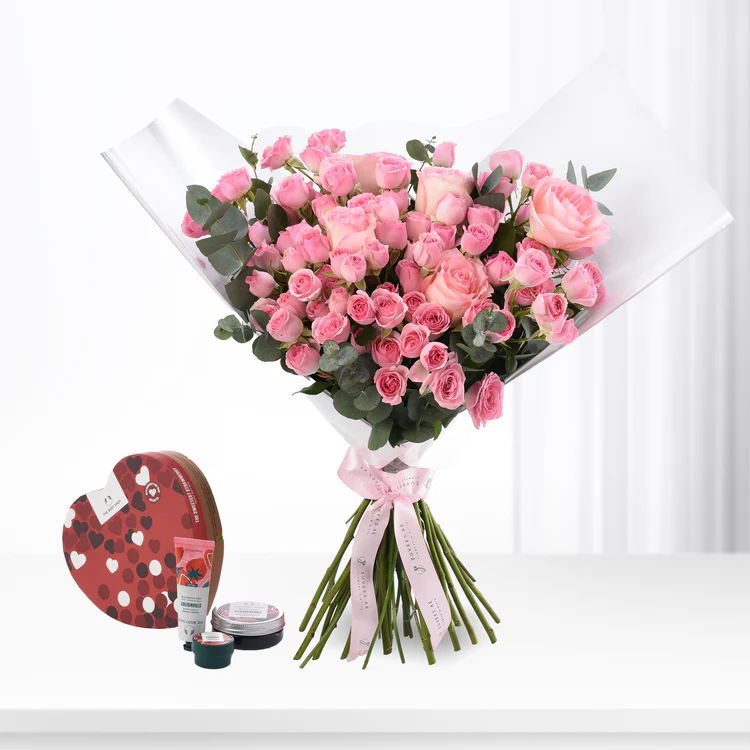 Pink flower bouquet with skincare essentials