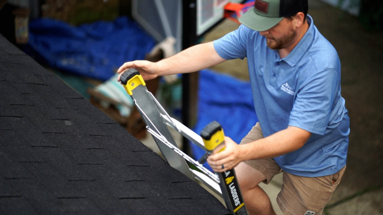 a professional roofer in ombile alabama from wise builders roofin preparing to inspect a asphalt shingle roof